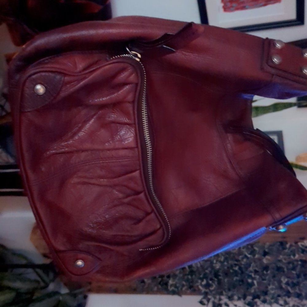 B. Makowsky red leather bag
